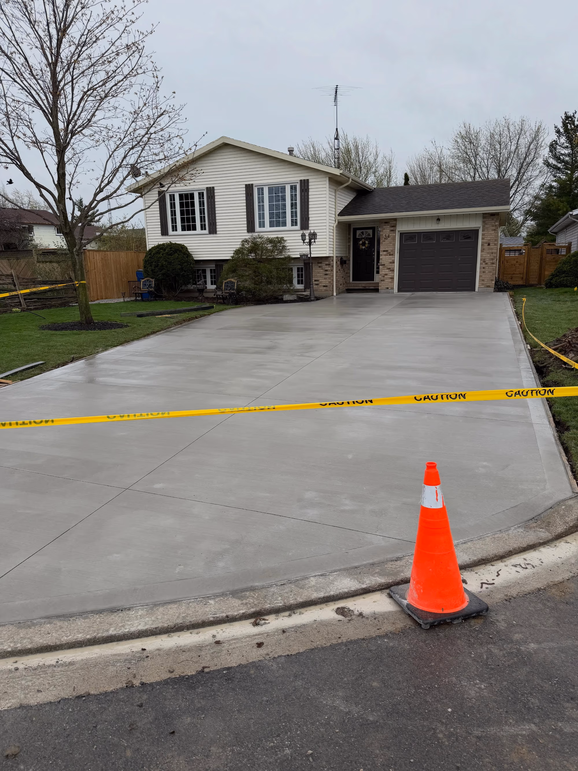 Freshly poured broom-finished concrete driveway in Chatham-Kent
